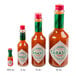 A group of TABASCO mini hot sauce bottles.