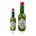 Two green bottles of TABASCO Green Pepper Hot Sauce with white labels.