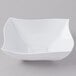 A white square Fineline Wavetrends plastic serving bowl with a curved edge.