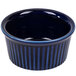 A blue china fluted ramekin with a striped rim.