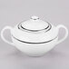 A white porcelain sugar bowl with silver lines and a lid.