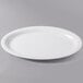 A white oval platter on a gray surface.