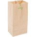 A close-up of a Duro brown paper bag with green text.