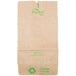 A brown paper bag with green writing that says Duro.