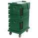A green Kentucky Green Cambro Ultra Camcart for food pans with black handles on wheels.