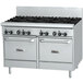 A large stainless steel Garland commercial range with black knobs on the burners.