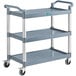 A gray plastic utility cart with three shelves, wheels, and handles.
