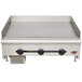 A Wells heavy duty stainless steel countertop griddle with three burners.