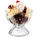 A Libbey glass bowl filled with ice cream and brownies.