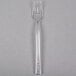 A clear plastic Fineline Tiny Tines tasting fork.