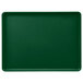 A green Cambro dietary tray with a white border.