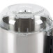 A close-up of a stainless steel Robot Coupe cutter bowl with a lid.