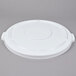 A white plastic lid with a circular design.