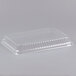A clear plastic Durable Packaging low dome lid on a white background.