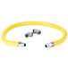 A yellow T&S Safe-T-Link gas appliance connector hose with silver metal fittings.