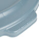 A close up of a gray Rubbermaid BRUTE trash can lid.