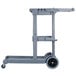 A grey Carlisle janitor cart with wheels and a handle.