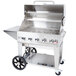 A Crown Verity stainless steel natural gas barbecue grill with a lid and wheels.