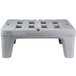A grey plastic Metro bow tie dunnage rack with legs and holes.