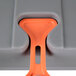 A Metro bow tie dunnage rack with orange handles.