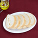 Sliced bread on a Thunder Group white melamine oval platter.