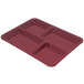 A dark cranberry Carlisle melamine tray with four compartments.