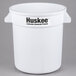 A white Continental 10 gallon round plastic trash can with black Huskee logo.