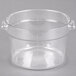 A Carlisle clear plastic food storage container with a handle.