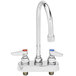 A chrome T&S deck-mounted workboard faucet with two handles and a swivel gooseneck spout.