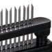 A black Chef Master meat tenderizer with 16 metal blades.