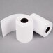 A case of 50 Point Plus white thermal paper rolls on a gray surface.
