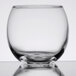 A close up of a clear Libbey glass votive candle holder.