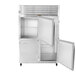 A stainless steel Traulsen reach-in refrigerator with two open doors.