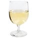 A Libbey Bristol Valley wine goblet filled with yellow liquid.