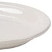 An ivory oval china platter with a narrow rim.