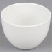 A Tuxton Florence bright white china bouillon cup on a gray surface.