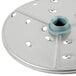 A Robot Coupe 1/4" grating/shredding disc, a circular metal plate with holes.