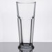 A close-up of a Libbey footed pilsner glass with a clear heart on the bottom.