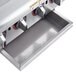 An APW Wyott natural gas lava rock charbroiler on a stainless steel counter.