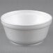 A white Dart foam bowl with a lid.