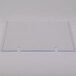 A clear rectangular acrylic panel with two holes.