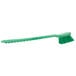 A green Carlisle Sparta pot scrub brush with a handle on a white background.