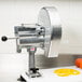A Nemco Easy Slicer with a black handle on a counter.