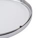 A round metal tray with a white background and a clear plexiglass face.