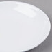 A white GET Water Lily melamine sauce dish.