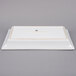 A white rectangular stoneware platter with a gold border.