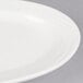 A CAC Garden State oval porcelain platter with a wavy rim.