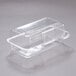 A Dart clear hinged PET plastic oblong container with a clear lid.