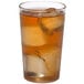 A Cambro clear plastic tumbler filled with ice tea on a white background.