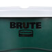 A Rubbermaid BRUTE 55 gallon green round recycle/trash can with white lid and dolly.